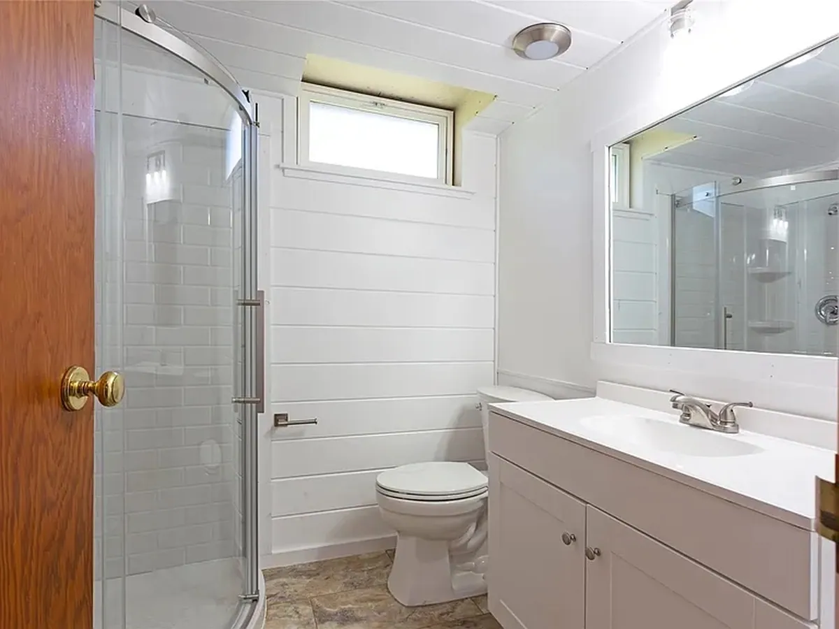 Full bathroom remodel with glass shower enclosure and new vanity