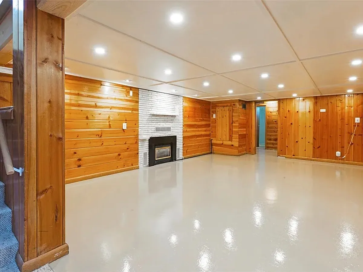 A cured high-gloss epoxy floor in a finished basement