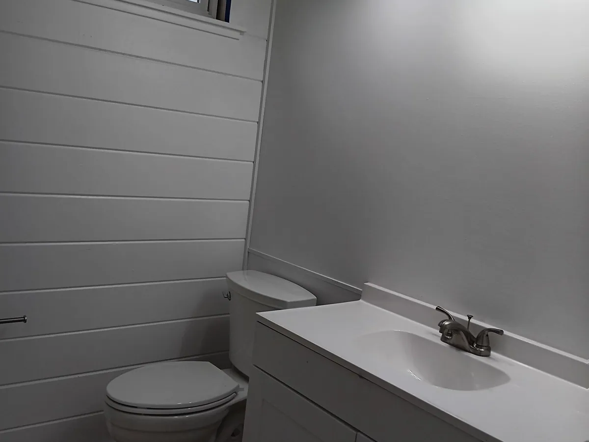 Shiplap wall detail in a completed bathroom remodel