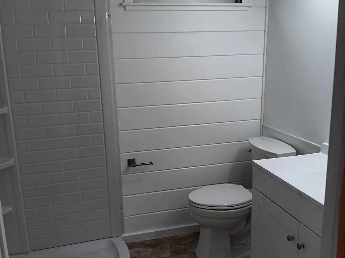 A bathroom we fully remodeled with new shower, vanity and fixtures